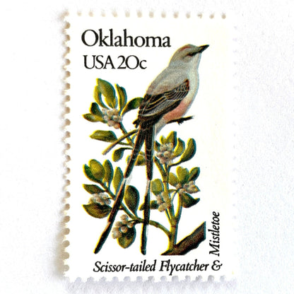 Image of Oklahoma State Bird and Flower postage stamps from 1982, featuring a Scissor-Tailed Flycatcher and Mistletoe on vintage unused 20-cent USPS postage, Scott 1988.