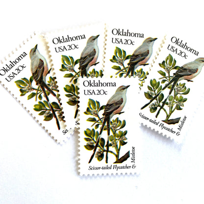 Image of Oklahoma State Bird and Flower postage stamps from 1982, featuring a Scissor-Tailed Flycatcher and Mistletoe on vintage unused 20-cent USPS postage, Scott 1988.