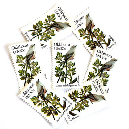 Image of Oklahoma State Bird and Flower postage stamps from 1982, featuring a Scissor-Tailed Flycatcher and Mistletoe on vintage unused 20-cent USPS postage, Scott 1988.