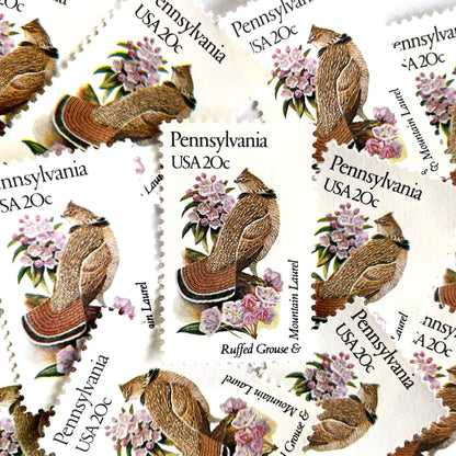 Image of Pennsylvania State Bird and Flower postage stamps from 1982, featuring a Ruffed Grouse and Mountain Laurel on vintage unused 20-cent USPS postage, Scott 1990.