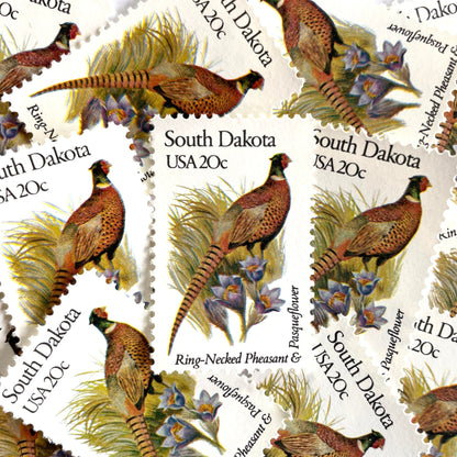 South Dakota State Bird and Flower postage stamps from 1982 featuring a Ring-Necked Pheasant and Pasqueflower on vintage unused 20-cent USPS postage, Scott 1993.