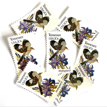 Tennessee State Bird and Flower postage stamps from 1982 featuring a Mockingbird and Iris on vintage unused 20-cent USPS postage, Scott 1994.