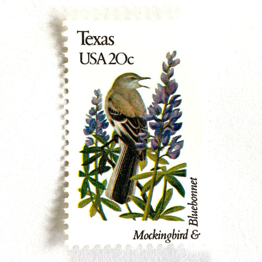Texas State Bird and Flower postage stamp from 1982 featuring a Mockingbird and Bluebonnet on vintage unused 20-cent USPS postage, Scott 1995.