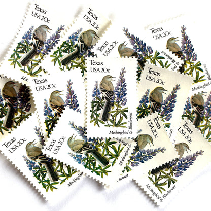 Texas State Bird and Flower postage stamps from 1982 featuring a Mockingbird and Bluebonnet on vintage unused 20-cent USPS postage, Scott 1995.