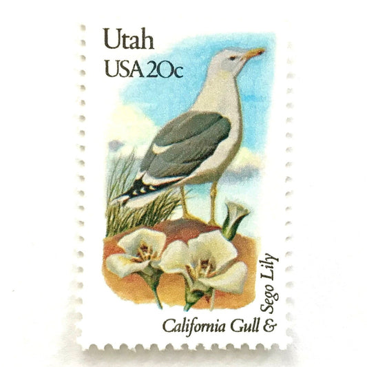 Utah State Bird and Flower postage stamps from 1982 featuring a California Gull and Sego Lily on vintage unused 20-cent USPS postage, Scott 1996.