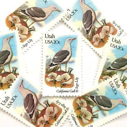 Utah State Bird and Flower postage stamps from 1982 featuring a California Gull and Sego Lily on vintage unused 20-cent USPS postage, Scott 1996.
