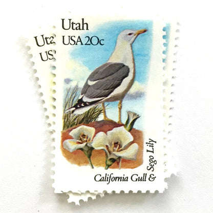 Utah State Bird and Flower postage stamps from 1982 featuring a California Gull and Sego Lily on vintage unused 20-cent USPS postage, Scott 1996.