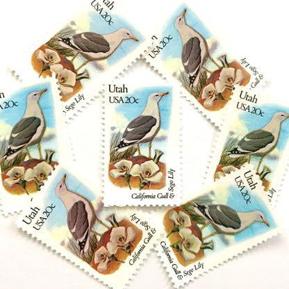 Utah State Bird and Flower postage stamps from 1982 featuring a California Gull and Sego Lily on vintage unused 20-cent USPS postage, Scott 1996.