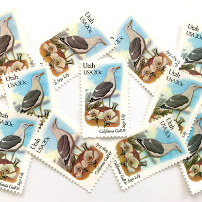Utah State Bird and Flower postage stamps from 1982 featuring a California Gull and Sego Lily on vintage unused 20-cent USPS postage, Scott 1996.