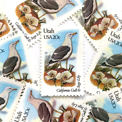 Utah State Bird and Flower postage stamps from 1982 featuring a California Gull and Sego Lily on vintage unused 20-cent USPS postage, Scott 1996.