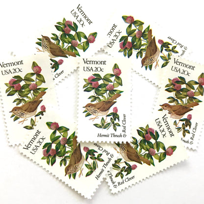 Vermont State Bird and Flower postage stamps from 1982 featuring a Hermit Thrush and Red Clover on vintage unused 20-cent USPS postage, Scott 1997.