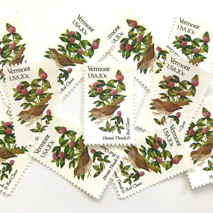 Vermont State Bird and Flower postage stamps from 1982 featuring a Hermit Thrush and Red Clover on vintage unused 20-cent USPS postage, Scott 1997.