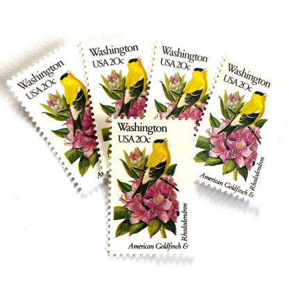 Washington State Bird and Flower postage stamps from 1982 featuring a Willow Goldfinch and Coast Rhododendron on vintage unused 20-cent USPS postage, Scott 1999.