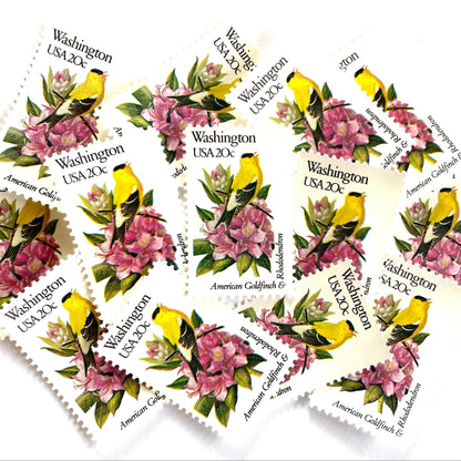 Washington State Bird and Flower postage stamps from 1982 featuring a Willow Goldfinch and Coast Rhododendron on vintage unused 20-cent USPS postage, Scott 1999.