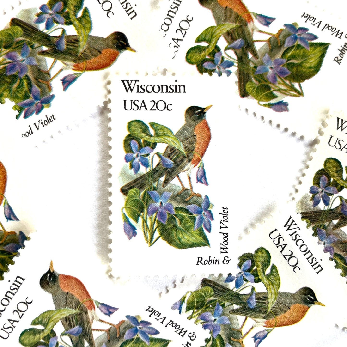 Wisconsin State Bird and Flower postage stamps from 1982 featuring a Robin and Wood Violet on vintage unused 20-cent USPS postage, Scott 2001.