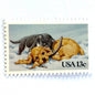 Image of 1982 Christmas Issue “Kitten and Puppy” 13-cent stamps. Scott #2025. Stamp Themes: Pets, Cat, Dog, Humane Society, Play, Snow, Winter. Light Blue postage stamp.