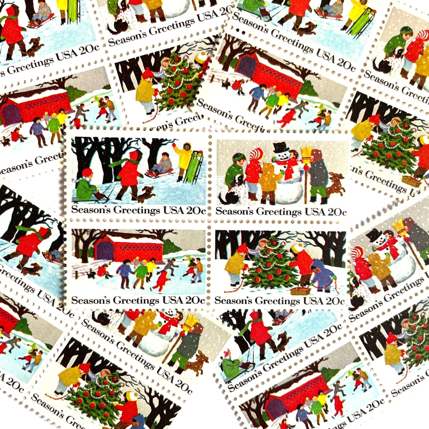 Image of 1982 Contemporary Christmas “Season's Greetings” 20 cent stamps. Scott #2027-30. Stamp Themes: Christmas, Holidays, Winter, Sledding, Ice Skating, Snowman Building, Christmas Tree Decorating, Snow, Cold, Children Playing. Christmas Issue Se-Tenant set of four connected stamps.
