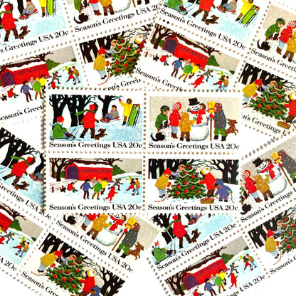 Image of 1982 Contemporary Christmas “Season's Greetings” 20 cent stamps. Scott #2027-30. Stamp Themes: Christmas, Holidays, Winter, Sledding, Ice Skating, Snowman Building, Christmas Tree Decorating, Snow, Cold, Children Playing. Christmas Issue Se-Tenant set of four connected stamps.