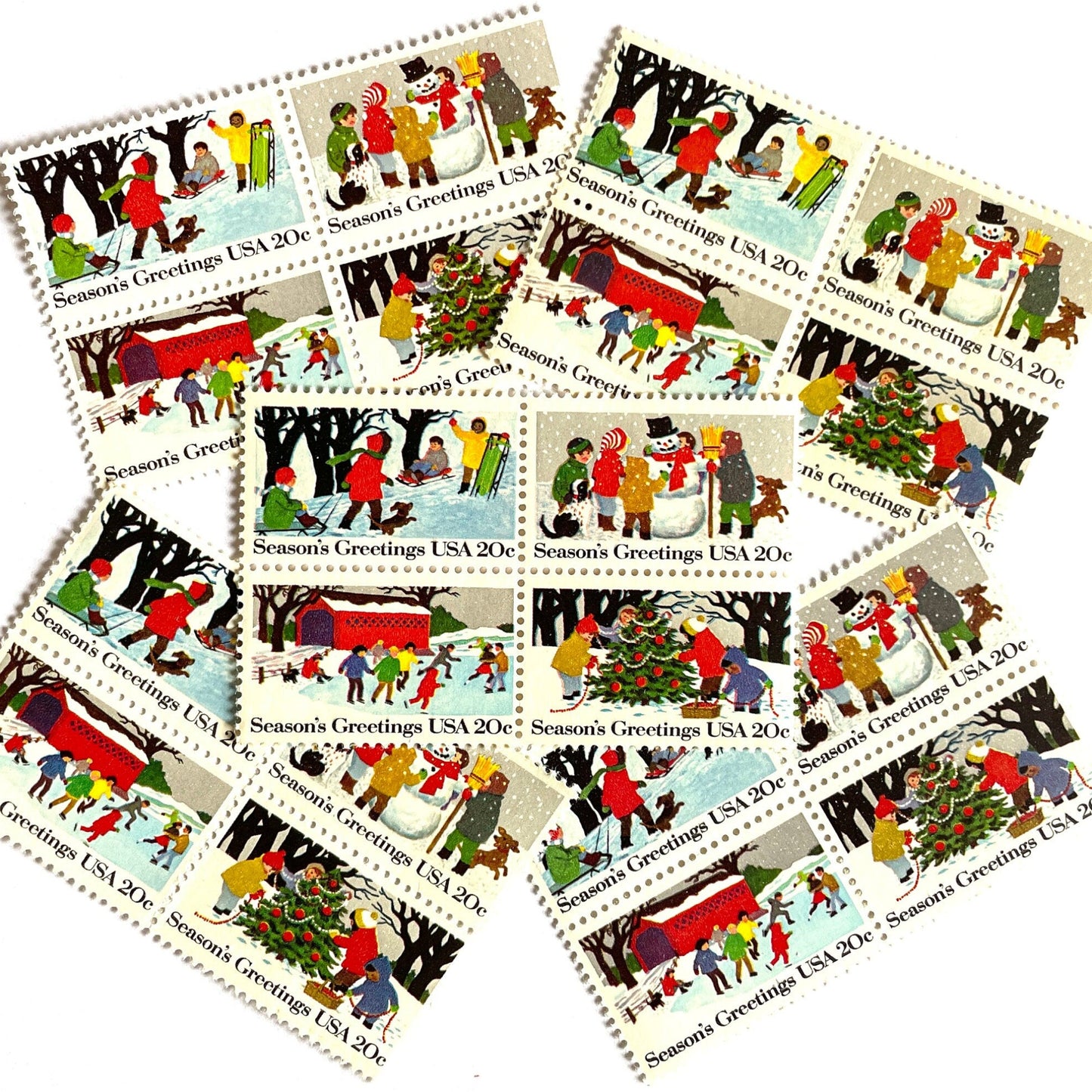 Image of 1982 Contemporary Christmas “Season's Greetings” 20 cent stamps. Scott #2027-30. Stamp Themes: Christmas, Holidays, Winter, Sledding, Ice Skating, Snowman Building, Christmas Tree Decorating, Snow, Cold, Children Playing. Christmas Issue Se-Tenant set of four connected stamps.