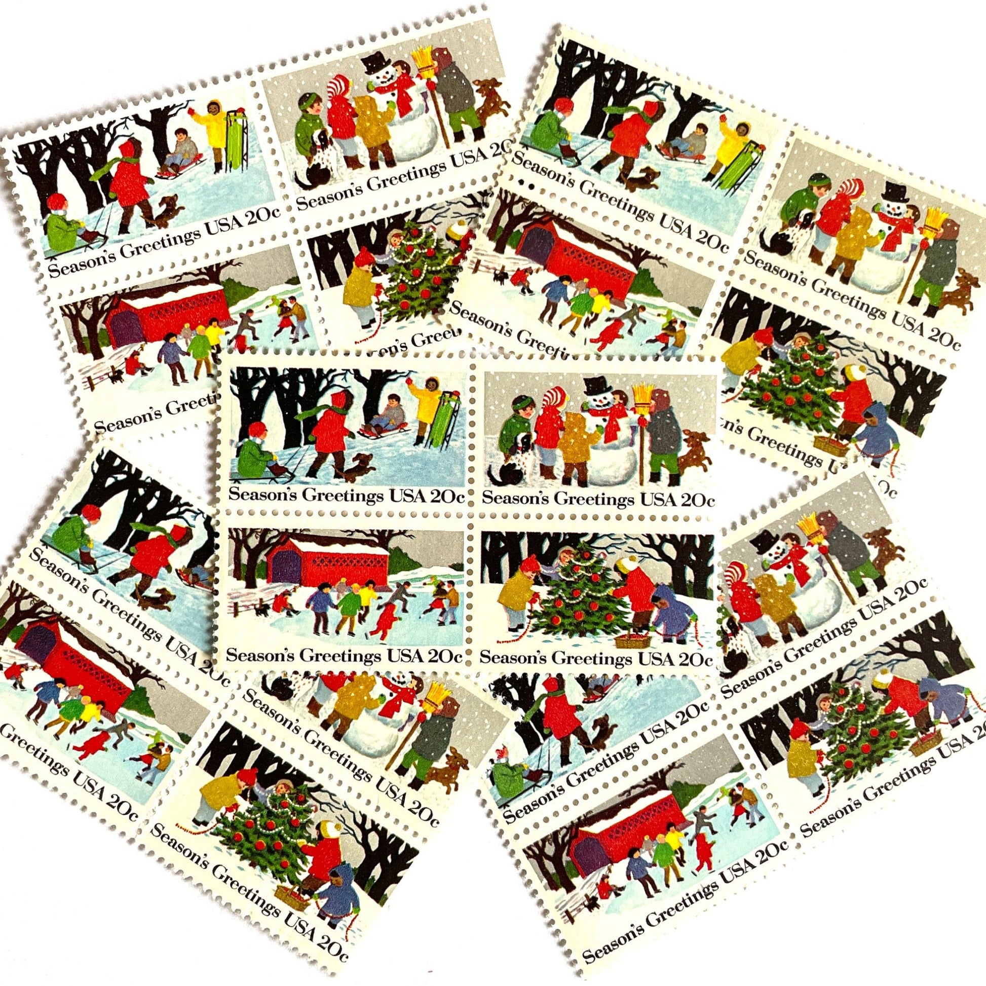 Image of 1982 Contemporary Christmas “Season's Greetings” 20 cent stamps. Scott #2027-30. Stamp Themes: Christmas, Holidays, Winter, Sledding, Ice Skating, Snowman Building, Christmas Tree Decorating, Snow, Cold, Children Playing. Christmas Issue Se-Tenant set of four connected stamps.