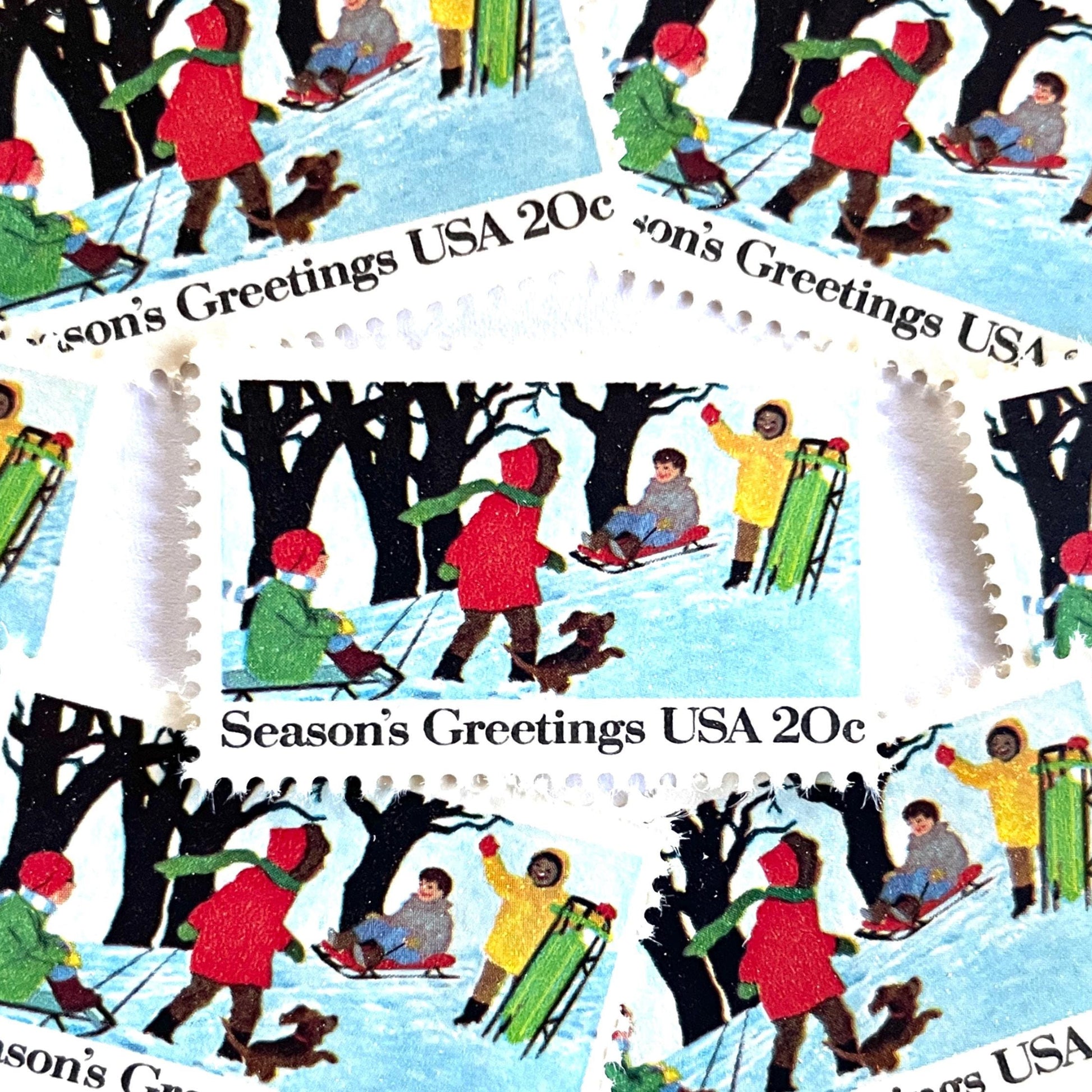 Image of 1982 Contemporary Christmas “Sledding” 20-cent stamps. Scott #2027. Stamp Themes: Christmas, Sledding, Snow, Children, Playing, Winter, Season’s Greetings. White postage stamp.