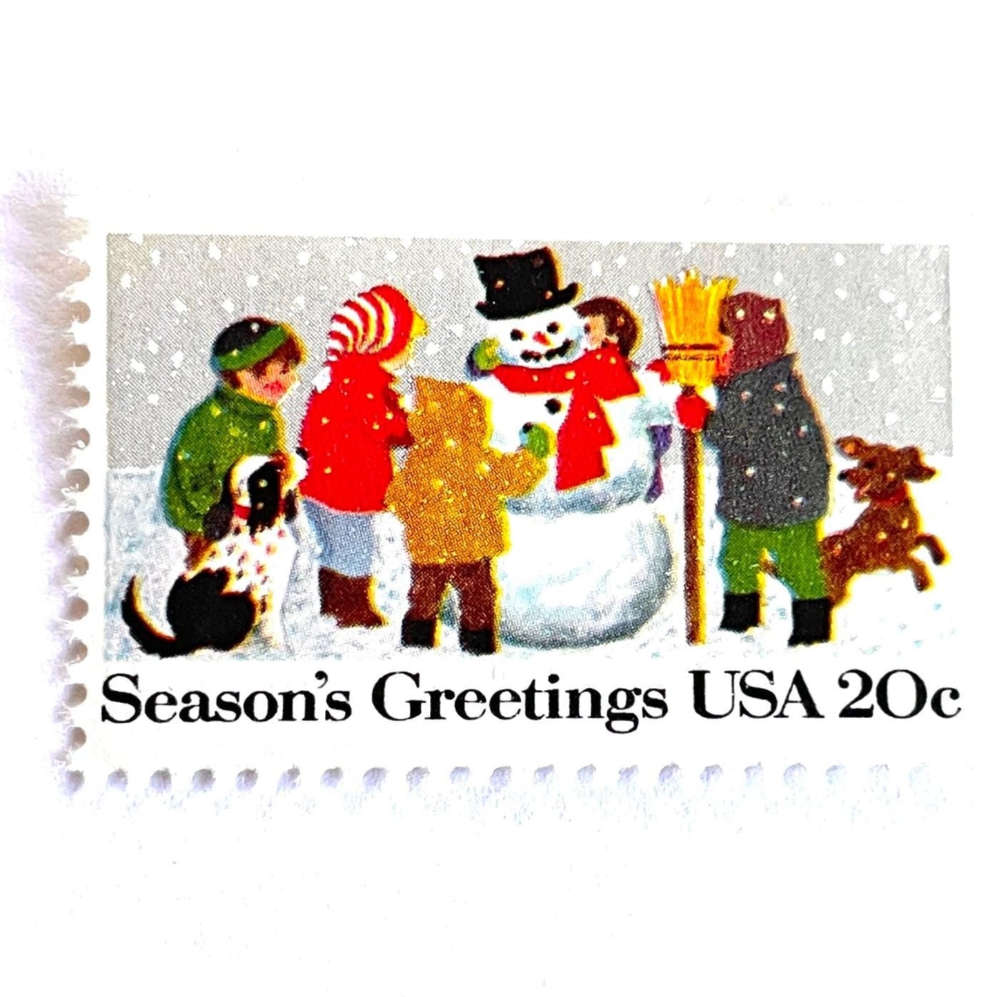 Image of 1982 Contemporary Christmas “Building a Snowman” 20-cent stamps. Scott #2028. Stamp Themes: Snowman, Christmas, Holidays, Winter, Children, Playing, Snowing, Season’s Greetings. White postage stamp.