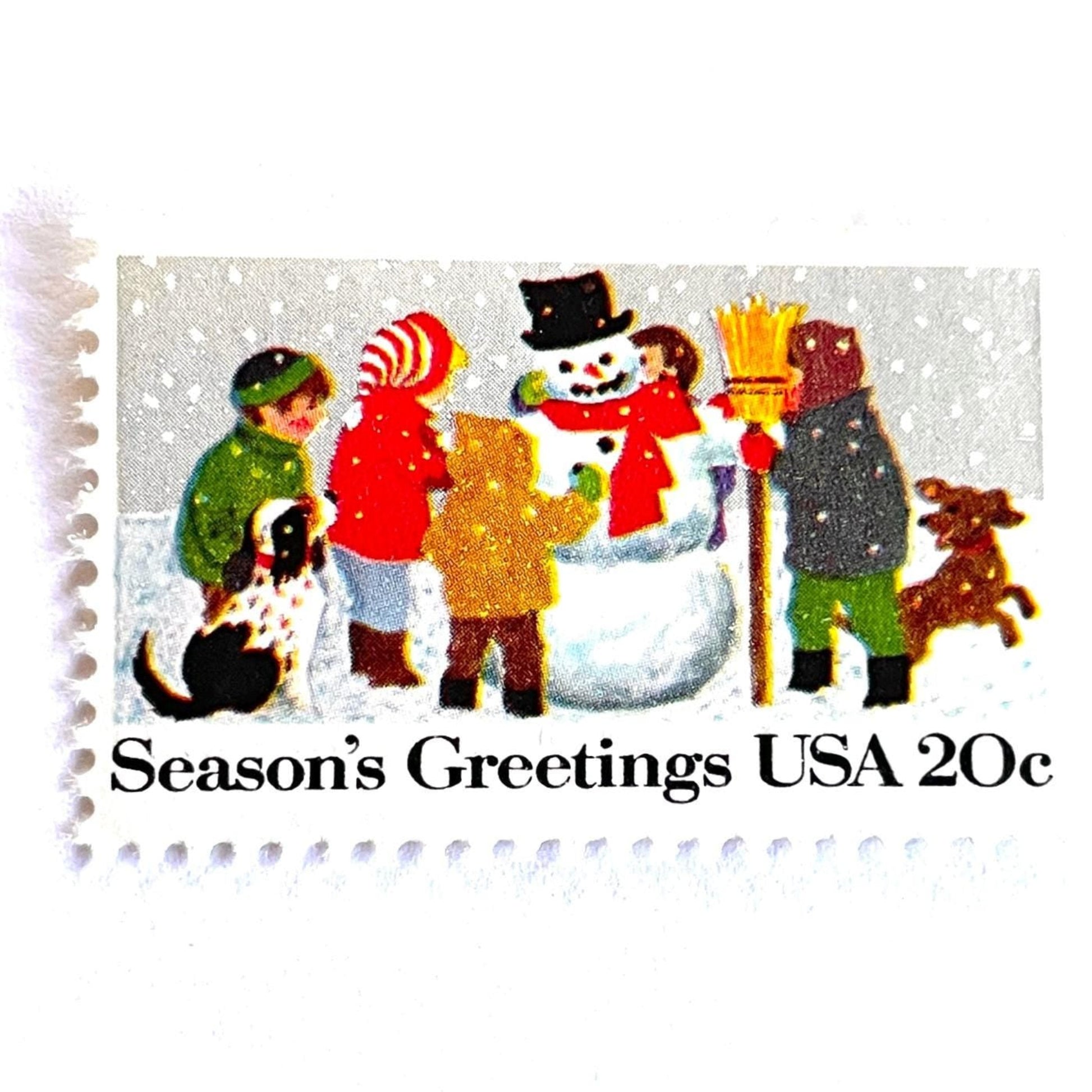 Image of 1982 Contemporary Christmas “Building a Snowman” 20-cent stamps. Scott #2028. Stamp Themes: Snowman, Christmas, Holidays, Winter, Children, Playing, Snowing, Season’s Greetings. White postage stamp.