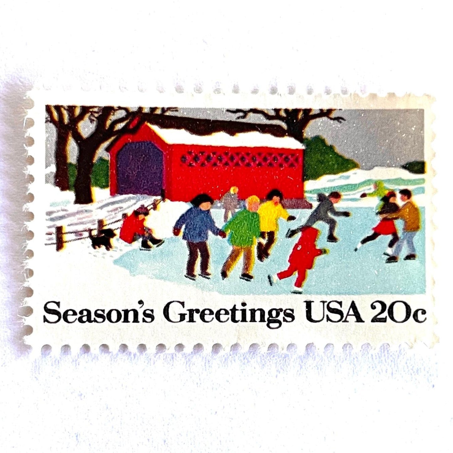 Image of 1982 Contemporary Christmas “Ice Skating” 20-cent stamps. Scott #2029. Stamp Themes: Ice Skating, Christmas, Winter Holidays, Snow, Winter Scene, Covered Bridge, Season's Greetings. Multicolored postage stamp.