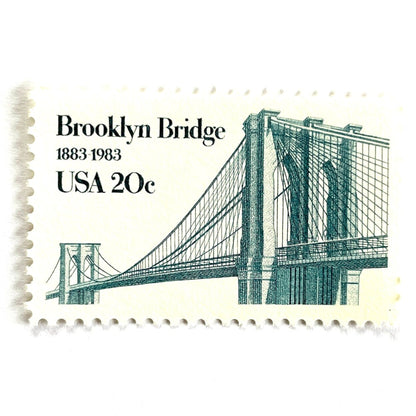 Image of 1983 “Brooklyn Bridge” 20-cent mail stamps. Scott #2041. Stamp Themes: 100th Anniversary of the Brooklyn Bridge, 8th Wonder of the World, NYC, New York City, Brooklyn. Blue postage stamp.