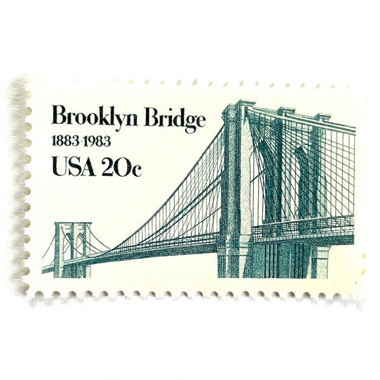 Image of 1983 “Brooklyn Bridge” 20-cent mail stamps. Scott #2041. Stamp Themes: 100th Anniversary of the Brooklyn Bridge, 8th Wonder of the World, NYC, New York City, Brooklyn. Blue postage stamp.