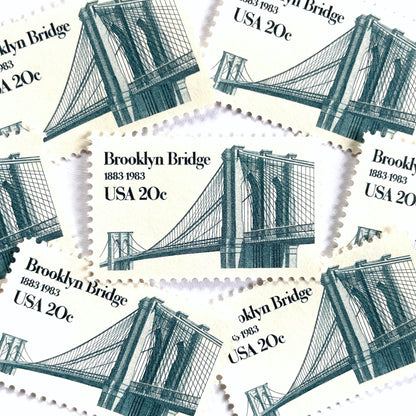 Image of 1983 “Brooklyn Bridge” 20-cent mail stamps. Scott #2041. Stamp Themes: 100th Anniversary of the Brooklyn Bridge, 8th Wonder of the World, NYC, New York City, Brooklyn. Blue postage stamp.