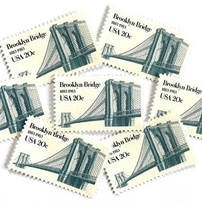 Image of 1983 “Brooklyn Bridge” 20-cent mail stamps. Scott #2041. Stamp Themes: 100th Anniversary of the Brooklyn Bridge, 8th Wonder of the World, NYC, New York City, Brooklyn. Blue postage stamp.