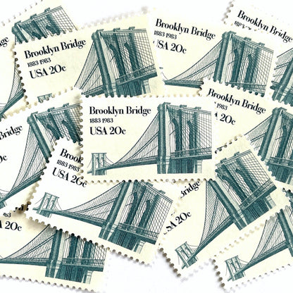 Image of 1983 “Brooklyn Bridge” 20-cent mail stamps. Scott #2041. Stamp Themes: 100th Anniversary of the Brooklyn Bridge, 8th Wonder of the World, NYC, New York City, Brooklyn. Blue postage stamp.