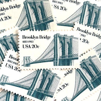 Image of 1983 “Brooklyn Bridge” 20-cent mail stamps. Scott #2041. Stamp Themes: 100th Anniversary of the Brooklyn Bridge, 8th Wonder of the World, NYC, New York City, Brooklyn. Blue postage stamp.