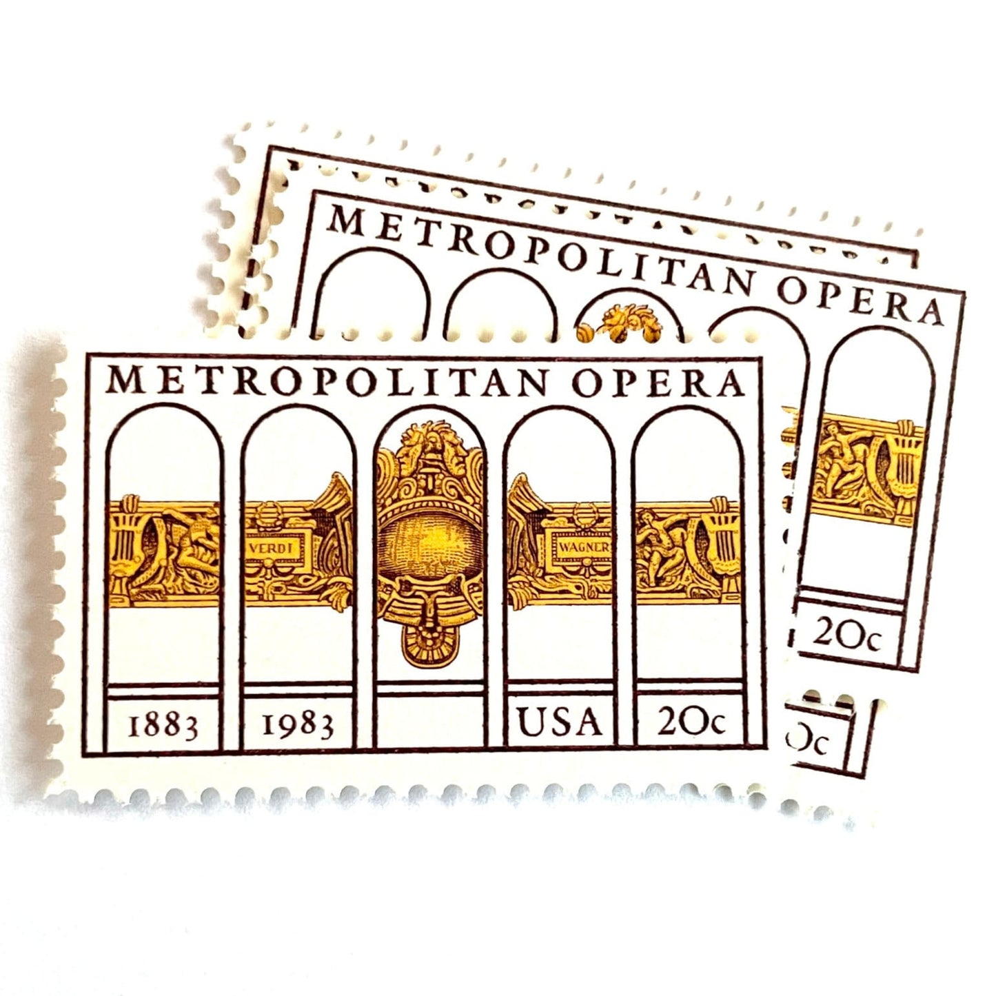 Image of 1983 “Metropolitan Opera” 20-cent mail stamps. Scott #2054. Stamp Themes: The Met, 100th Anniversary of New York's Opera, Opera House, NYC, New York City. Gold, Yellow, Maroon postage stamp.