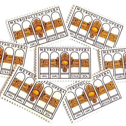 Image of 1983 “Metropolitan Opera” 20-cent mail stamps. Scott #2054. Stamp Themes: The Met, 100th Anniversary of New York's Opera, Opera House, NYC, New York City. Gold, Yellow, Maroon postage stamp.