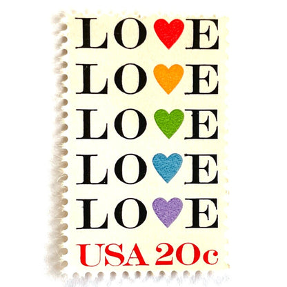 Love with Hearts postage stamp from 1984 featuring repeated LOVE lettering with five different-colored hearts on vintage unused 20-cent USPS postage, Scott 2072.