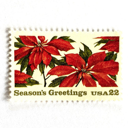 Image of 1985 Contemporary Christmas “Poinsettia Plants” 22-cent stamps. Scott #2166. Stamp Themes: Christmas Flora, Holiday Plants, Season's Greetings, Flores de Noche Buena. Red and green postage stamp.