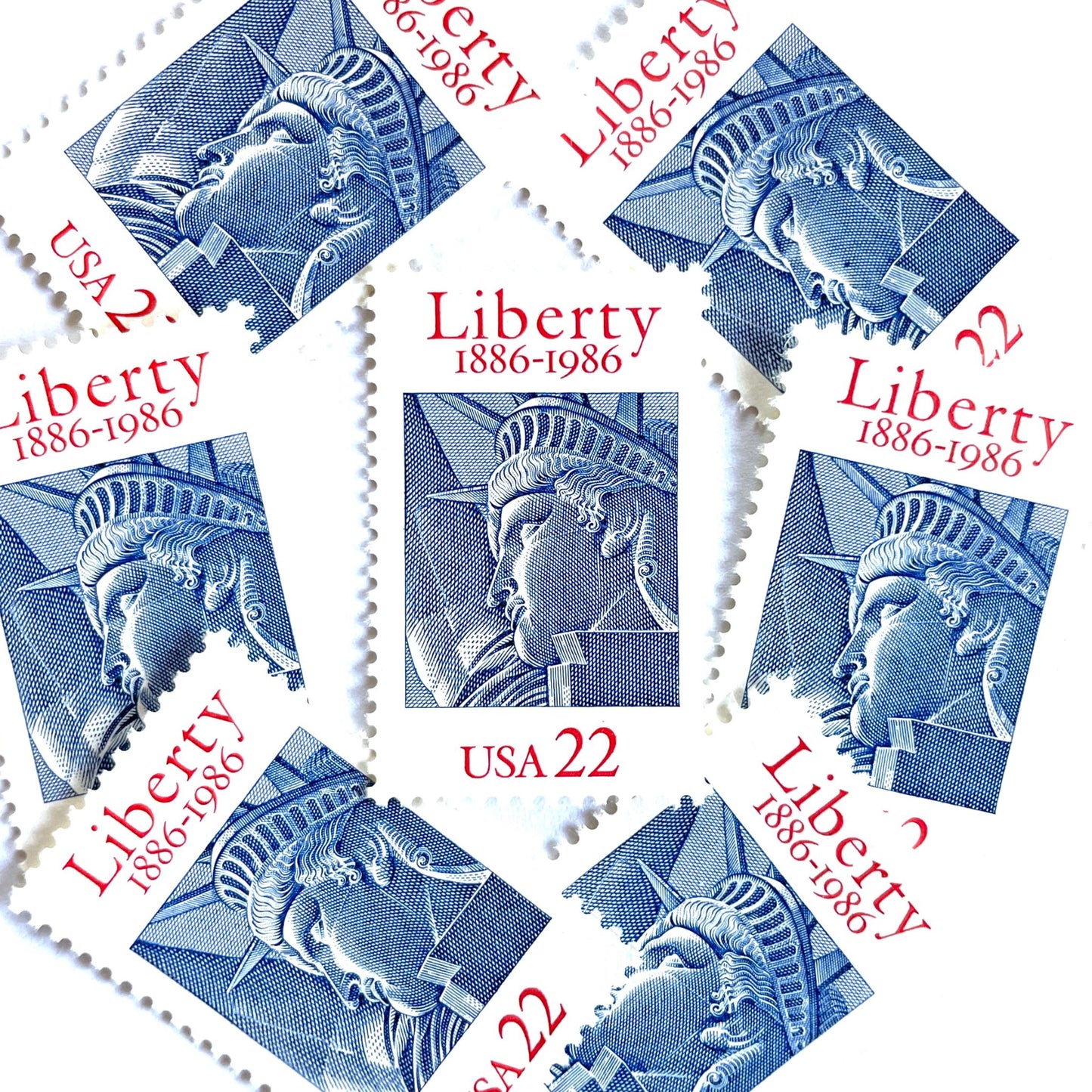 Image of 1986 “Statue of Liberty” 22-cent mail stamps. Scott #2224. Stamp Themes: Statue of Liberty, Joint Issue with France, NYC, New York City, Immigration. Red, white, and blue postage stamp.