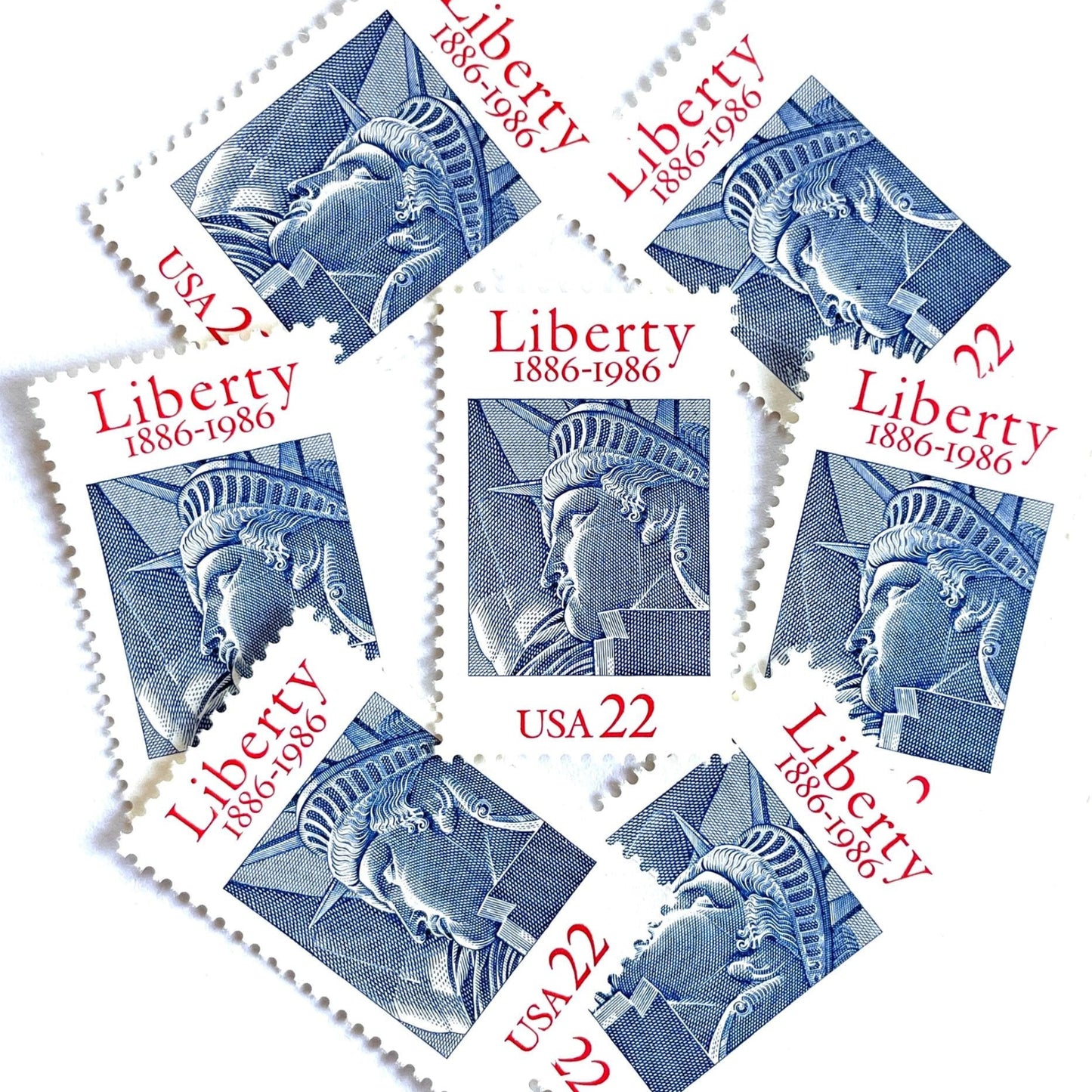 Image of 1986 “Statue of Liberty” 22-cent mail stamps. Scott #2224. Stamp Themes: Statue of Liberty, Joint Issue with France, NYC, New York City, Immigration. Red, white, and blue postage stamp.