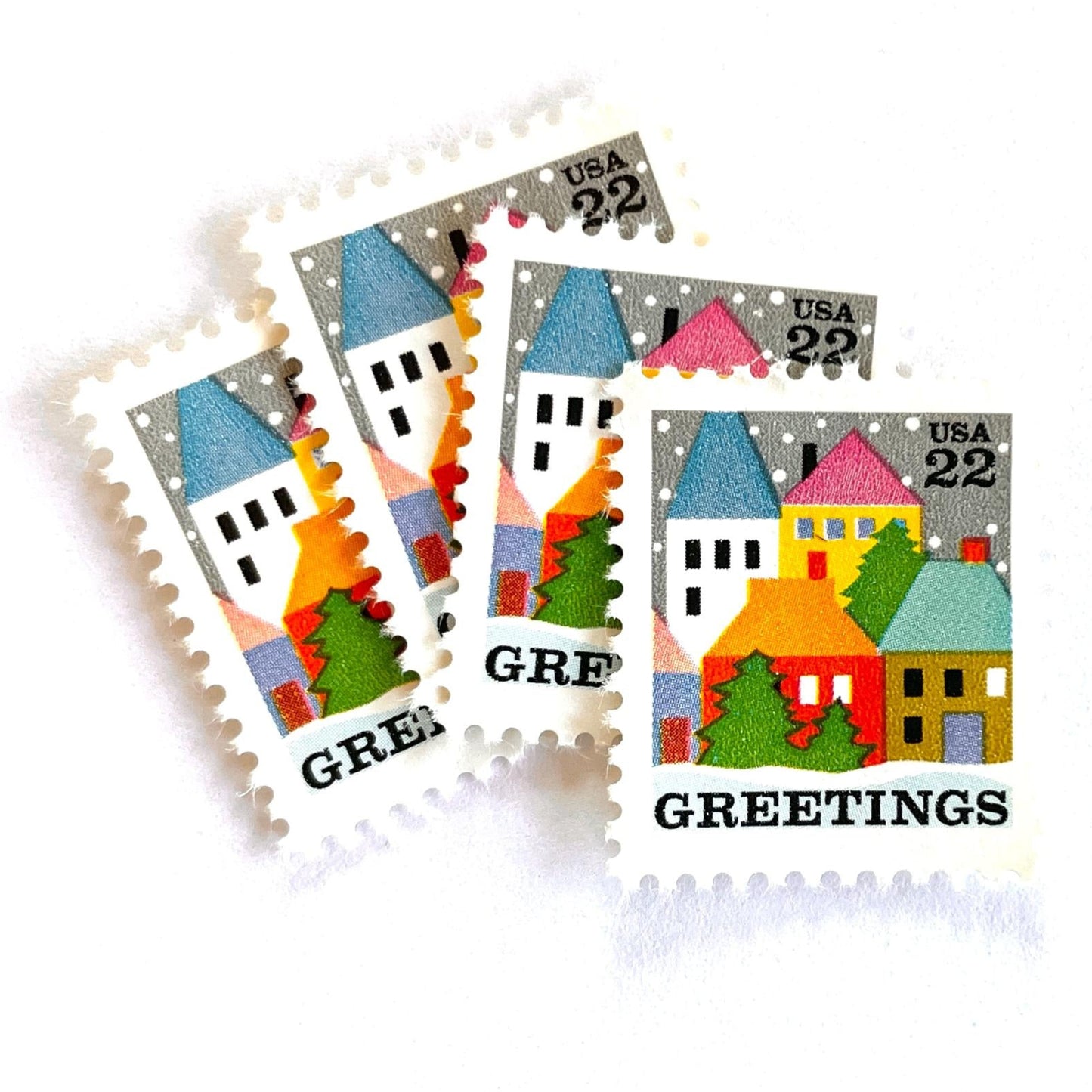 Image of 1986 Contemporary Christmas “Winter Village Scene” 22 cent stamps. Scott #2245. Stamp Themes: Christmas, Holidays, Greetings, Winter, Snow, Snowing, Houses. Multicolored postage stamp.