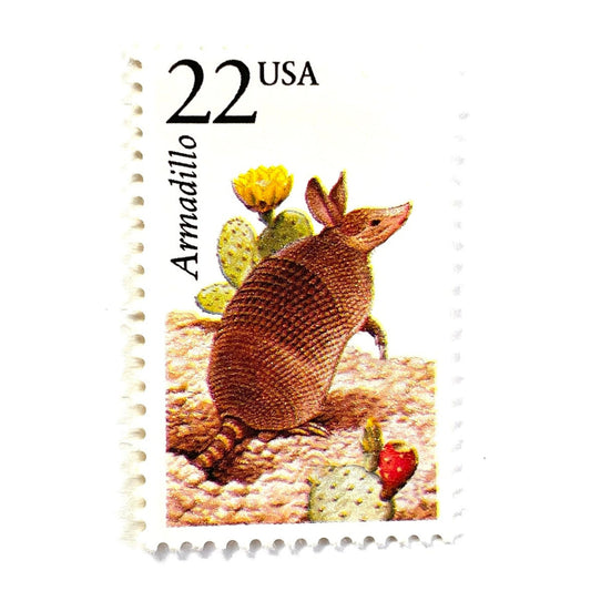 Image of 1987 North American Wildlife Series “Armadillo” 22-cent mail stamps. Scott #2296. Stamp Themes: Armored Shell, Cactus, Desert, Southwest, Texas. Earthy Tones, Multicolored postage stamp.