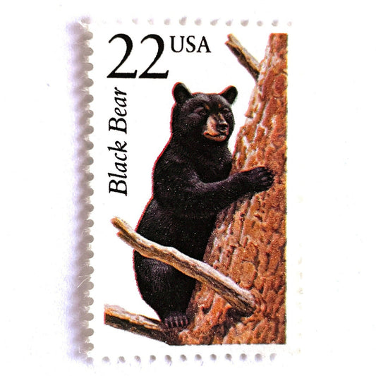 Image of 1987 North American Wildlife Series “Black Bear” 22-cent vintage unused USPS mail stamps. Scott #2299. Stamp Themes: Wildlife, Nature, Bear, Teddy Bear, Tree Climbing, Mountain Wedding, Forest Wedding, Conservation. Brown, Black, Multicolored postage stamp. Perfect vintage postage stamp to use for save the date announcements, wedding invitation postage, shower invitations, birth announcements, thank you cards, birthday party invites, and snail mail.
