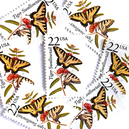 Image of 1987 North American Wildlife Series “Tiger Swallowtail Butterfly” 22-cent unused mail stamps. Scott #2300. Stamp Themes: Wildlife, Nature, Insect, Flying Insect, Butterfly, Pollinator, Flight, Forests, Meadows, Gardens, Wildlife Conservation. Yellow, Black, Red, Multicolored postage stamp.