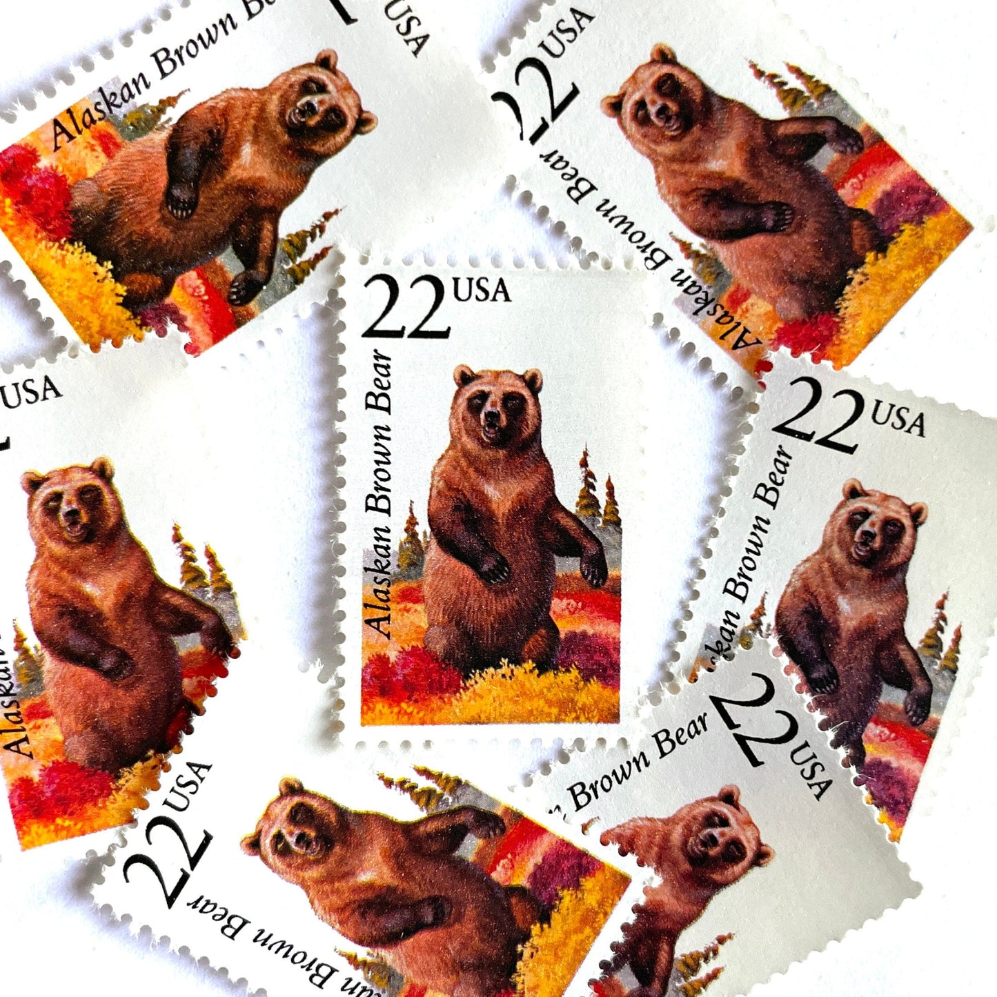 Image of 1987 North American Wildlife Series “Alaskan Brown Bear” 22-cent vintage unused USPS mail stamps. Scott #2310. Stamp Themes: Wildlife, Nature, Bear, Grizzly Bear, Kodiak Bear, Alaska, Autumn, Fall Colors, Memphis Grizzlies, Hunting. Brown, Red, Yellow, Green, Multicolored postage stamp. Perfect vintage postage stamp to use for save the date announcements, wedding invitation postage, shower invitations, thank you cards, birthday party invites, and snail mail.