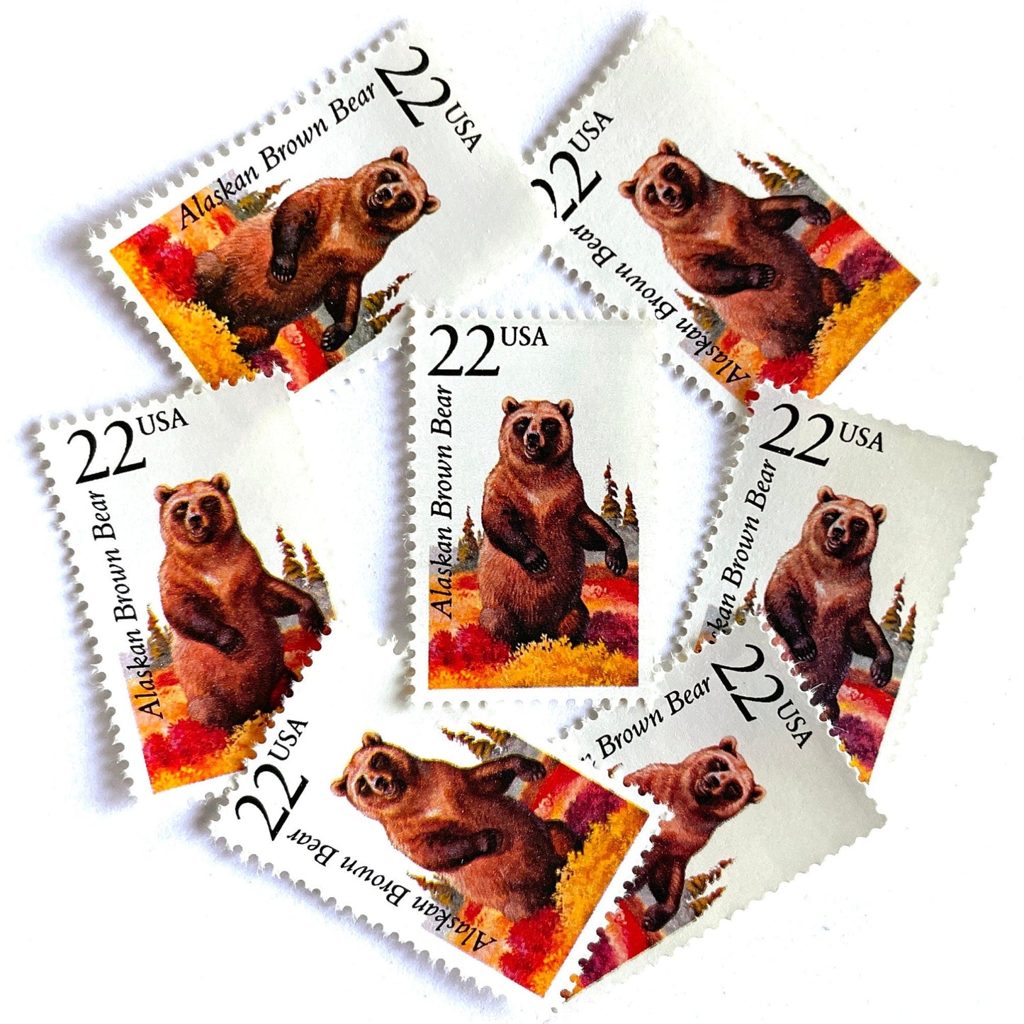 Image of 1987 North American Wildlife Series “Alaskan Brown Bear” 22-cent vintage unused USPS mail stamps. Scott #2310. Stamp Themes: Wildlife, Nature, Bear, Grizzly Bear, Kodiak Bear, Alaska, Autumn, Fall Colors, Memphis Grizzlies, Hunting. Brown, Red, Yellow, Green, Multicolored postage stamp. Perfect vintage postage stamp to use for save the date announcements, wedding invitation postage, shower invitations, thank you cards, birthday party invites, and snail mail.