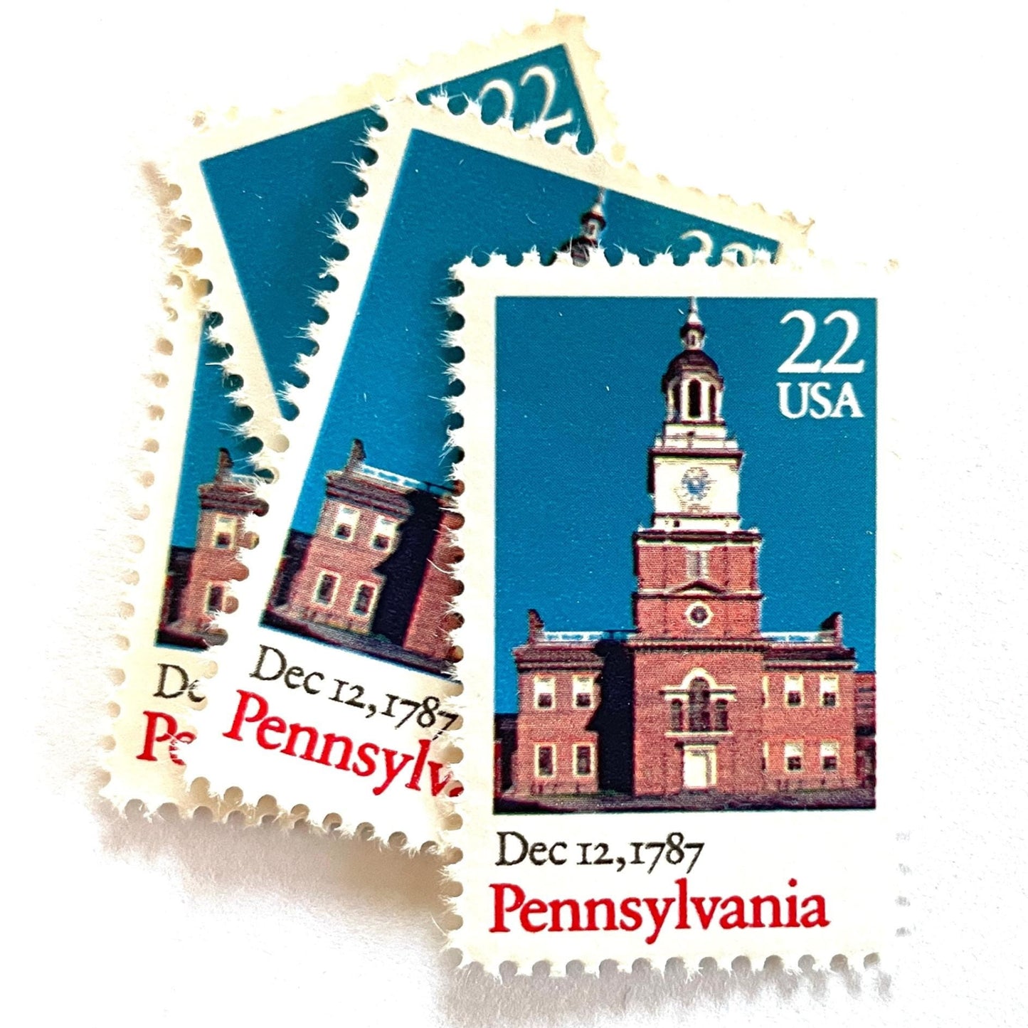 Image of Pennsylvania Statehood postage stamps from the 1987 Bicentenary Statehood series, featuring Philadelphia’s Independence Hall on vintage unused 22-cent USPS postage, Scott 2337.