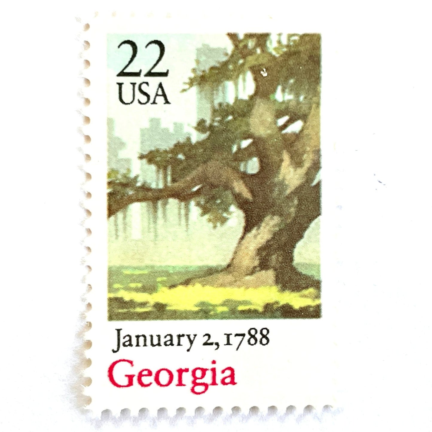 Image of Georgia Statehood postage stamps from the 1988 Bicentenary Statehood series, featuring a green live oak tree with Spanish moss and Atlanta skyline on vintage unused 22-cent USPS postage, Scott 2339.