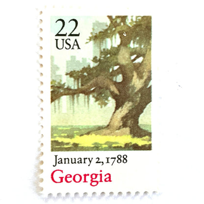 Image of Georgia Statehood postage stamps from the 1988 Bicentenary Statehood series, featuring a green live oak tree with Spanish moss and Atlanta skyline on vintage unused 22-cent USPS postage, Scott 2339.