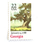 Image of Georgia Statehood postage stamps from the 1988 Bicentenary Statehood series, featuring a green live oak tree with Spanish moss and Atlanta skyline on vintage unused 22-cent USPS postage, Scott 2339.